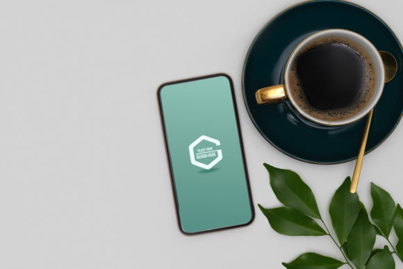 Mock-up of Smartphone on White Table Graphic Smartphone - Other By bongkarngraphic