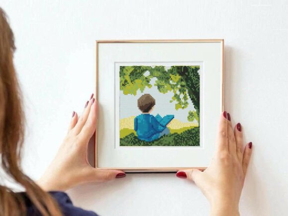Boy Reading Outdoors Cross Stitch PDF